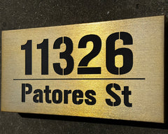 An illuminated Aluminum house sign that looks great during the day but truly shines at night with 46 LEDs and a dawn to dusk sensor - light Bronze finish